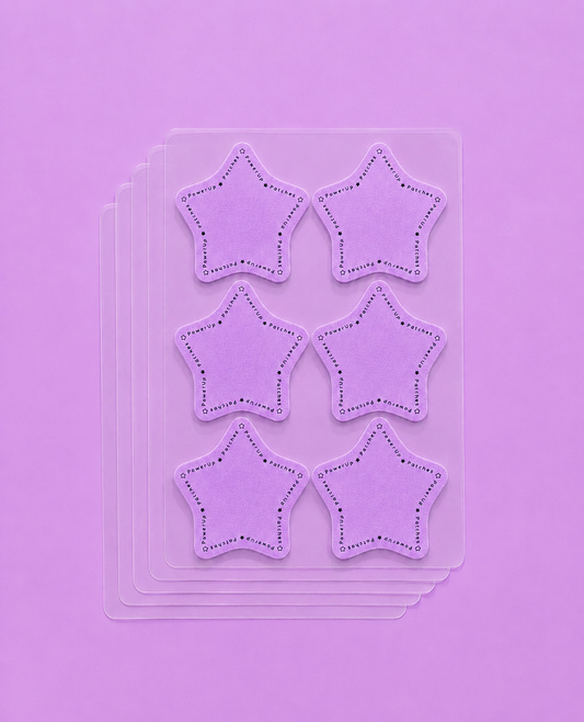 Six lavender star-shaped embellishments with dotted stitched borders, arranged in two columns on a clear plastic sheet over a solid lavender background.